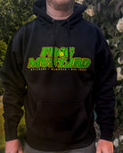Person wearing a black hoodie with green and yellow text in an outdoor setting