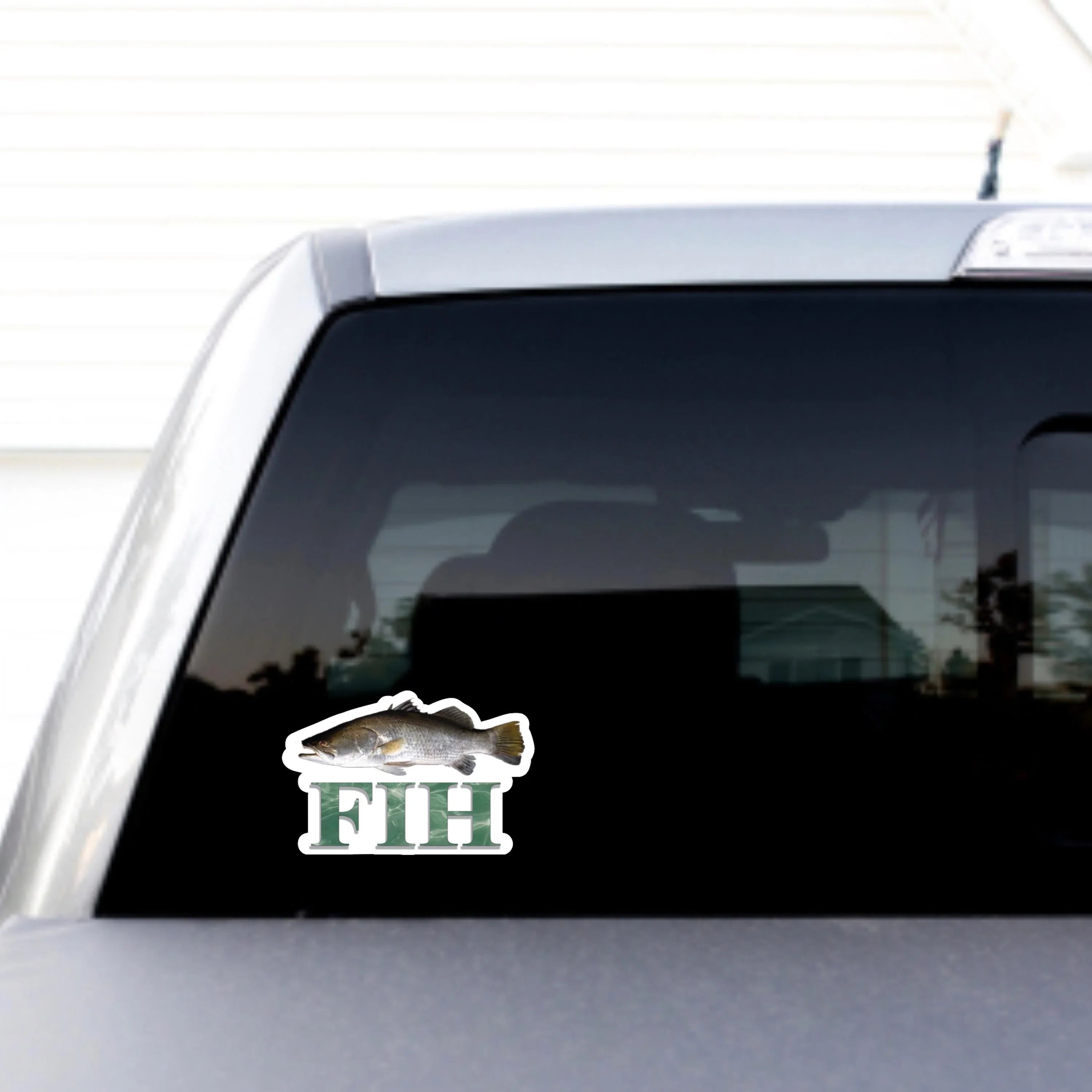 Fish sticker with 'FIH' text on car rear window, weatherproof vinyl design