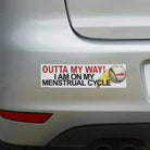 Funny car bumper sticker: 'Outta My Way! I Am On My Menstrual Cycle' with cartoon baseball face