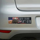 Bumper sticker with eagle, American flag, and 'These Colors Can't Run' text on car
