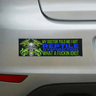 Edgy bumper sticker with skull, green flames, and bold text reading 'Reptile Dysfunction' on white car.